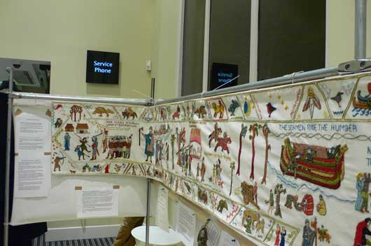 The embroidery was done in a style to emulate the Bayeux Tapestry