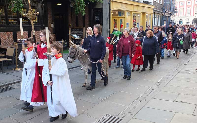 Pictured: Joey the donkey leads Palm Sunday procession to York Minster