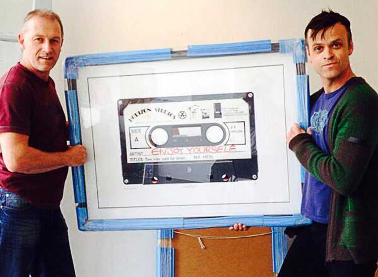 Art courier Andy Shrives delivers a Cassette painting to Greg McGee at According To Mcgee in York