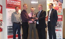 Super fit staff lift the York 10K Corporate Challenge trophy