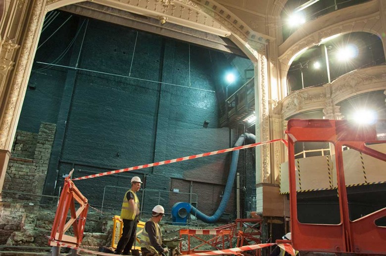 Archaeologists work under the shadow of the Theatre Royal arch