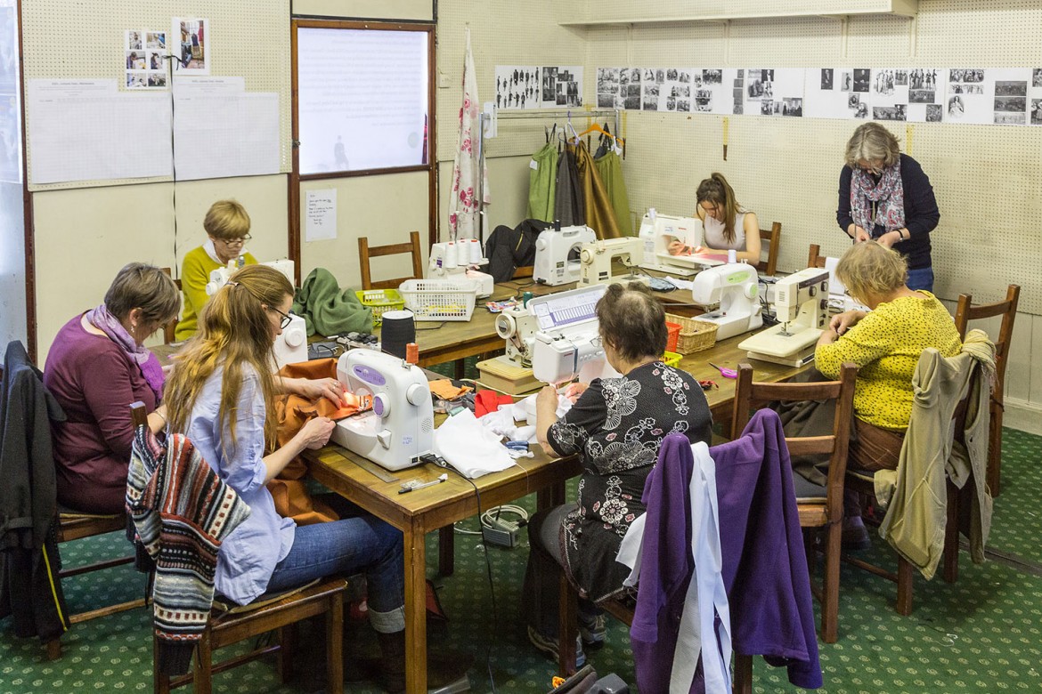 A team of volunteers work on the hundreds of costumes for In Fog And Falling Snow