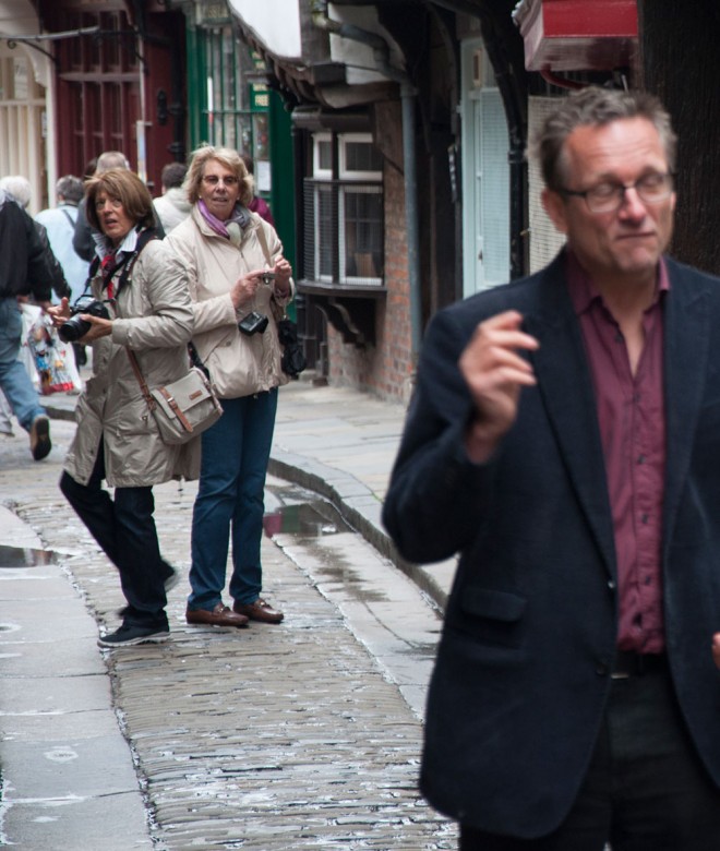 Passers-by get ready to do their own bit of camerawork