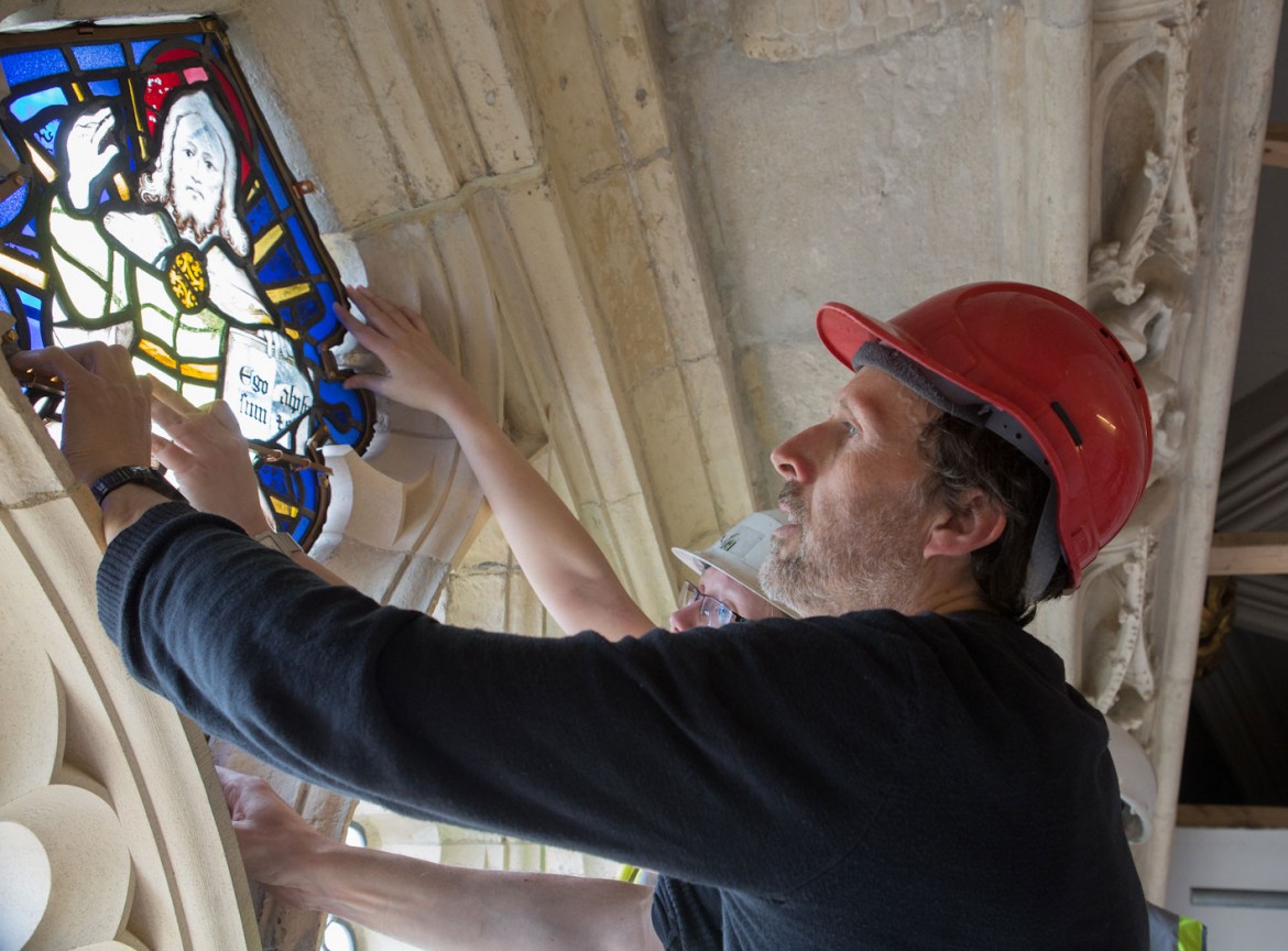 Handling the 600-year-old glass is a delicate task