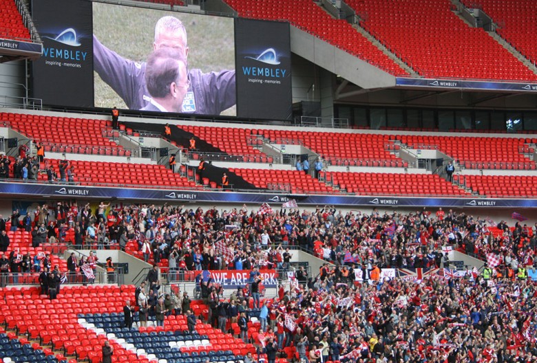 York City fans in triumph at the 2012 Conference play-off final. Photograph © Ian Gratton on Wikimedia Commons