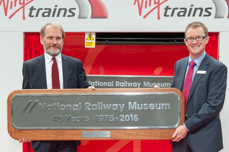 David Horne (right) presents a full-size train name plaque to the NRM's Paul Kirkman 