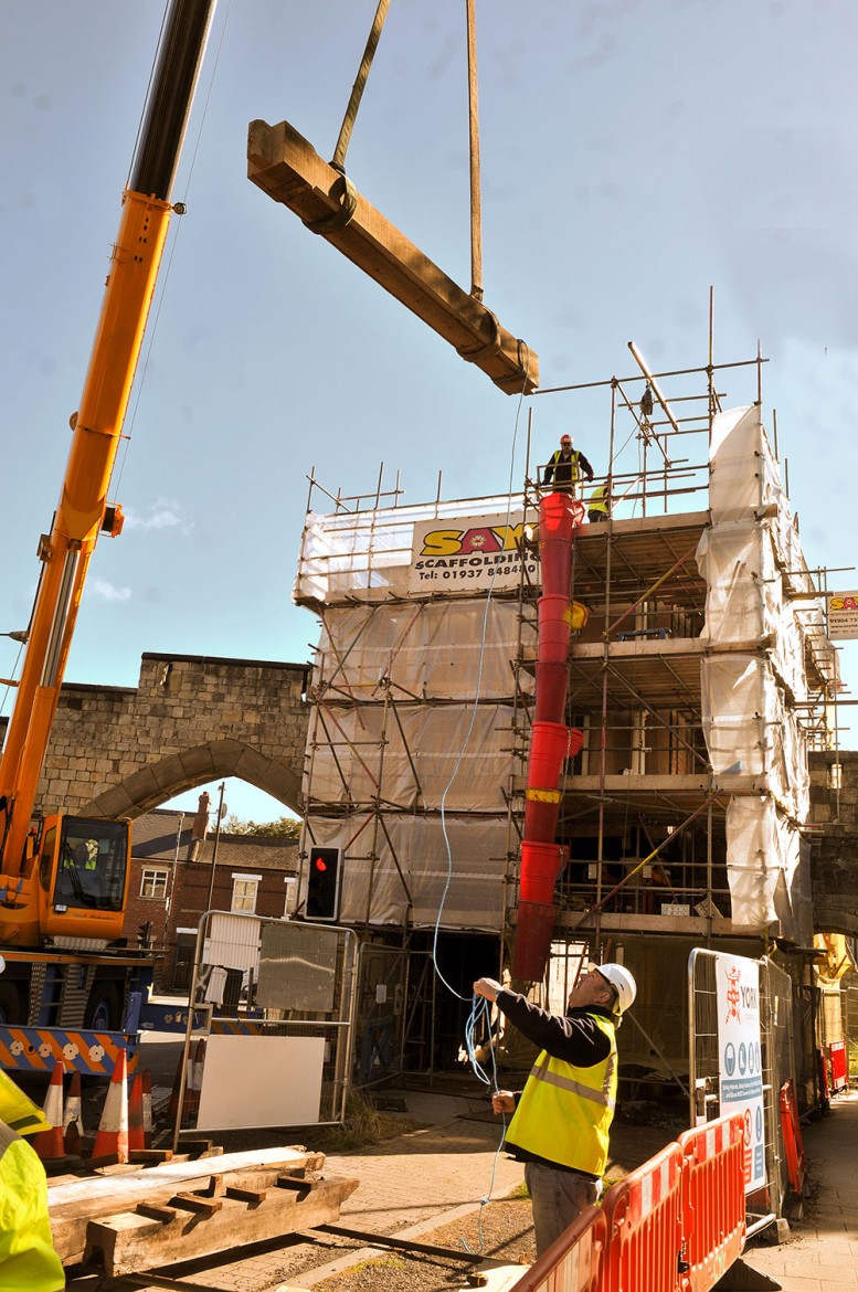 Heavy lifting… a beam is inched into place