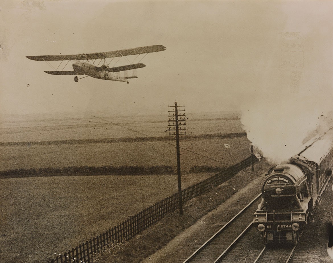 Plane passengers talk to people on board the Flying Scotsman as both reach 90mph. This amazing Daily Herald pic dates from March 1932