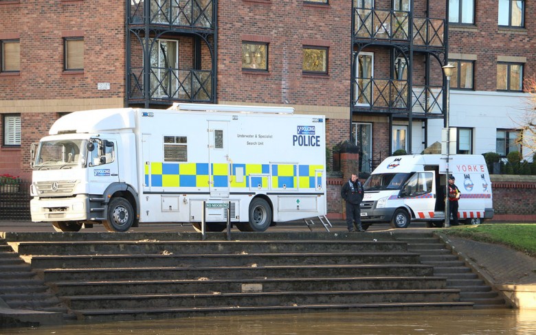 The police and York Rescue Boat  on the riverbank earlier this week in the search for Rory 