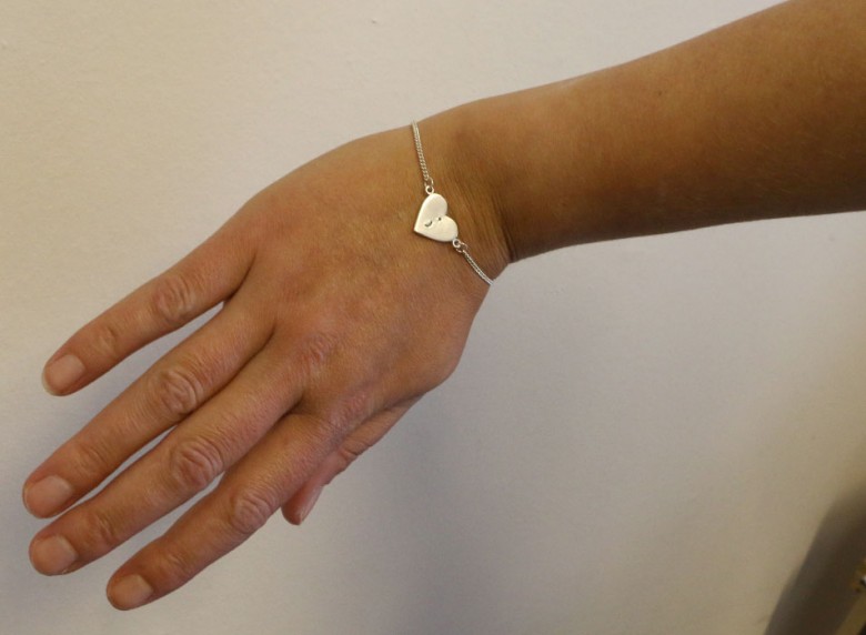 Anna wears a bracelet engraved with a semi-colon. This is a symbol of hope used by many people who have struggled with mental health problems to show that their life hasn't come to a full stop but goes on. Photograph: YorkMix