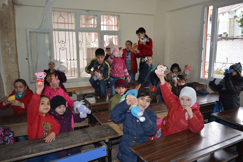 War-hit children in a classroom in south-east Turkey after receiving their toys