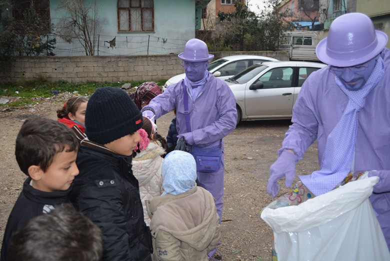 With his friend the ‘the Syrian purpleman’ handing out toys