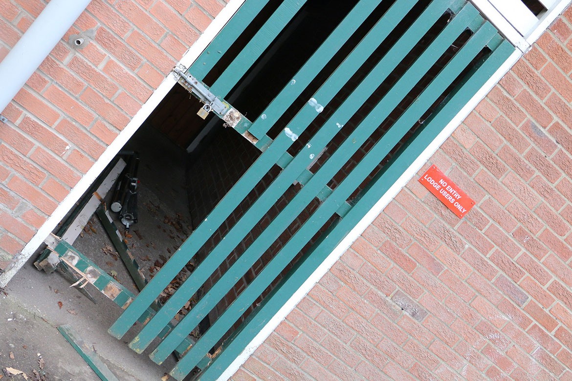 A locked gate is wrecked