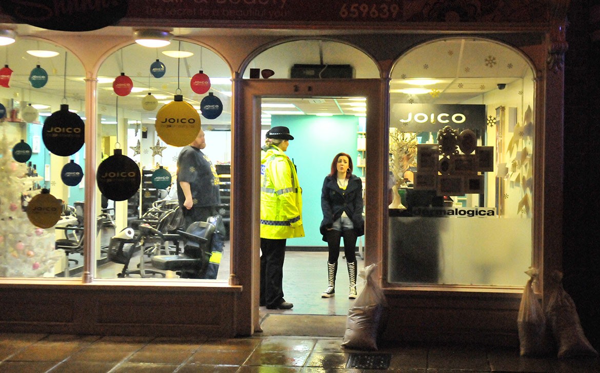 Police offer advice to business owners on Tower Street. Photograph: Nigel Holland