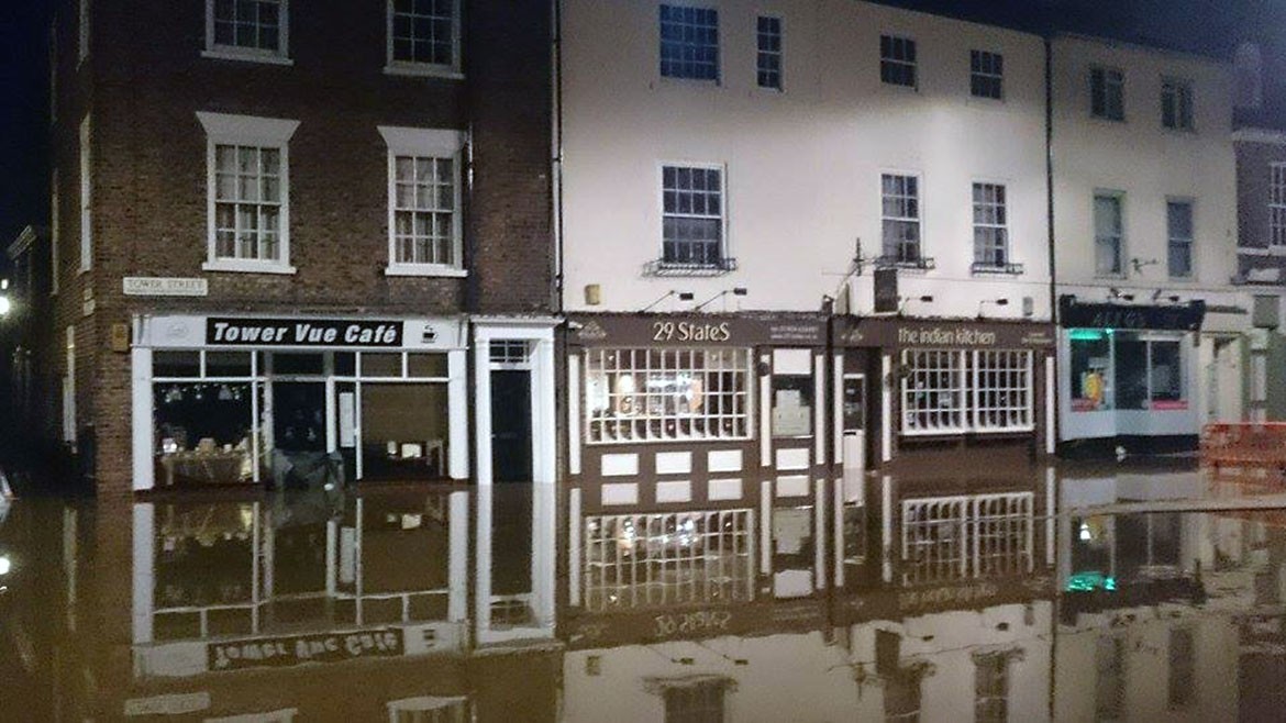 The water has inundated local businesses. Photograph: Nico Chendi