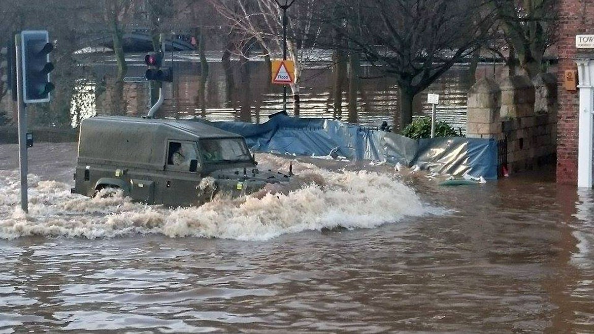 An Army Landrover drives through the floods on Tower Street. Photograph: Nico Chendi