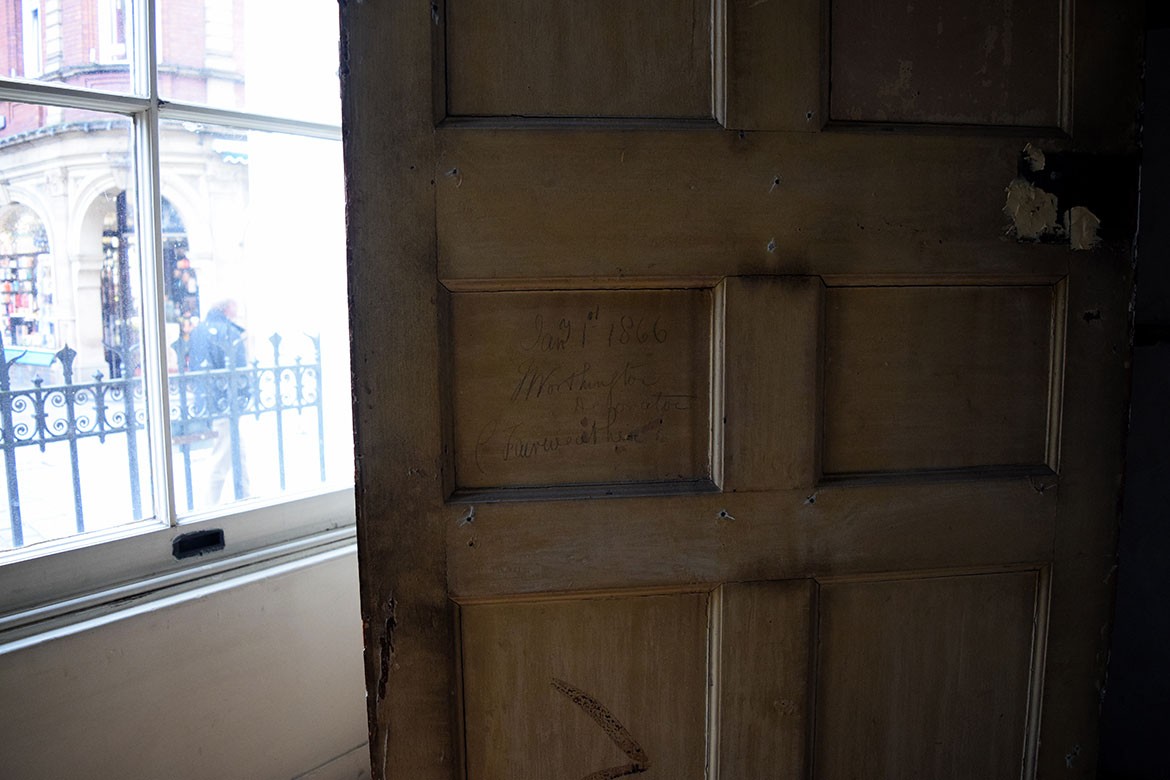 Some writing on a Mansion House door, left by J Worthington on January 1, 1866. Photograph: Richard Brigham / York Past & Present