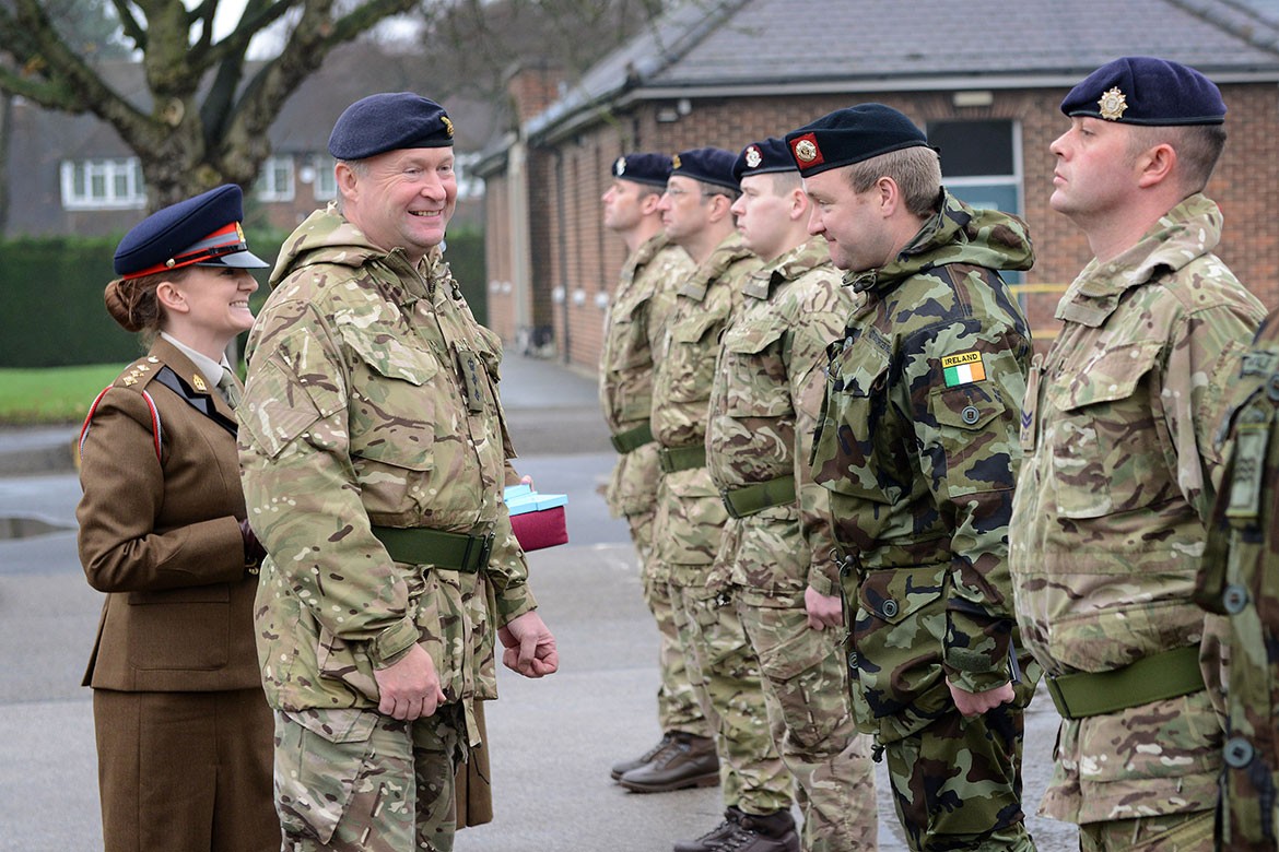 Colonel Neil Smith, Commander Medical Group, 203 Field Hospital presents soldiers from 34 Medical Group with their medals for their assistance in the fight against Ebola in Sierra Leone. Photographs: Corporal Luisa Scott