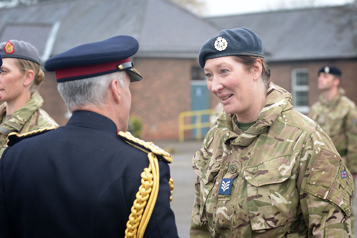 Sergeant Julie Jones, RAF, receives her medal from director general of the Army Medical Services, Major General Jeremy Rowan