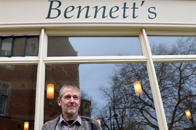 Mike outside his business