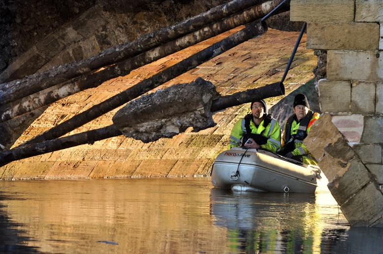 Flashback to engineers checking the damaged bridge at the end of December. Photographs: Nigel Holland