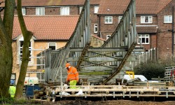 First picture of the Tadcaster footbridge – as engineers use pontoons to inspect stonework