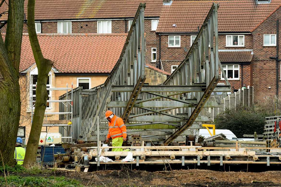 First picture of the Tadcaster footbridge – as engineers use pontoons to inspect stonework