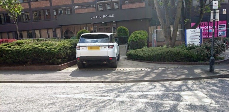 This car wasn't on his way in to Piccadilly Court. The driver parked here