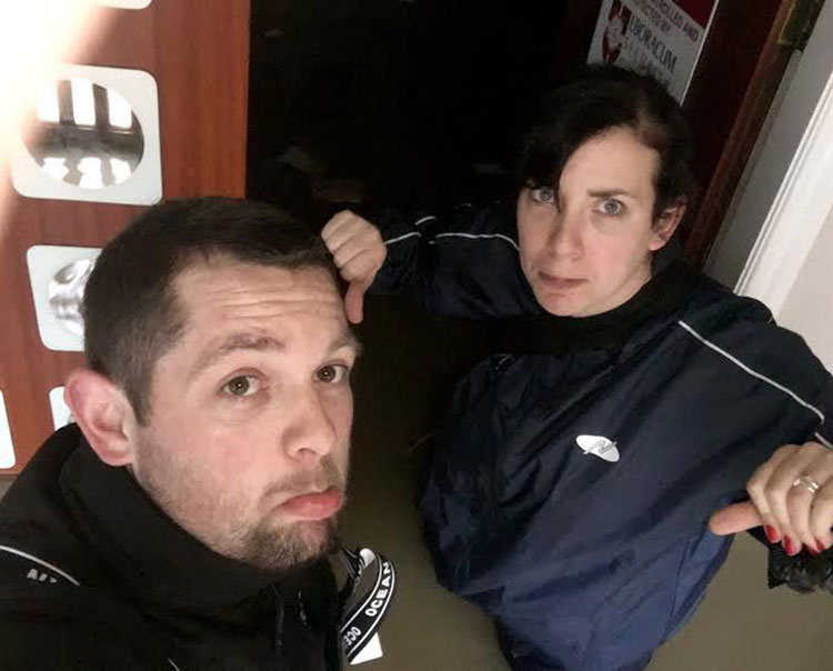 Carl and his wife wade in to the building