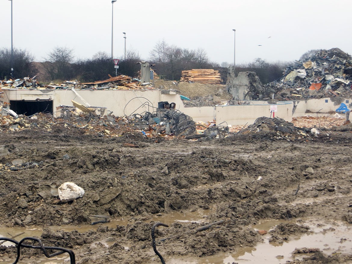 A sea of mud, with the lazy river tunnel in the background