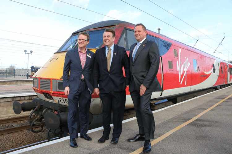 Culture secretary John Whittingdale (centre) with Sir Gary Verity of Welcome To Yorkshire and a Virgin East Coast train on York station. Photograph: Richard McDougall
