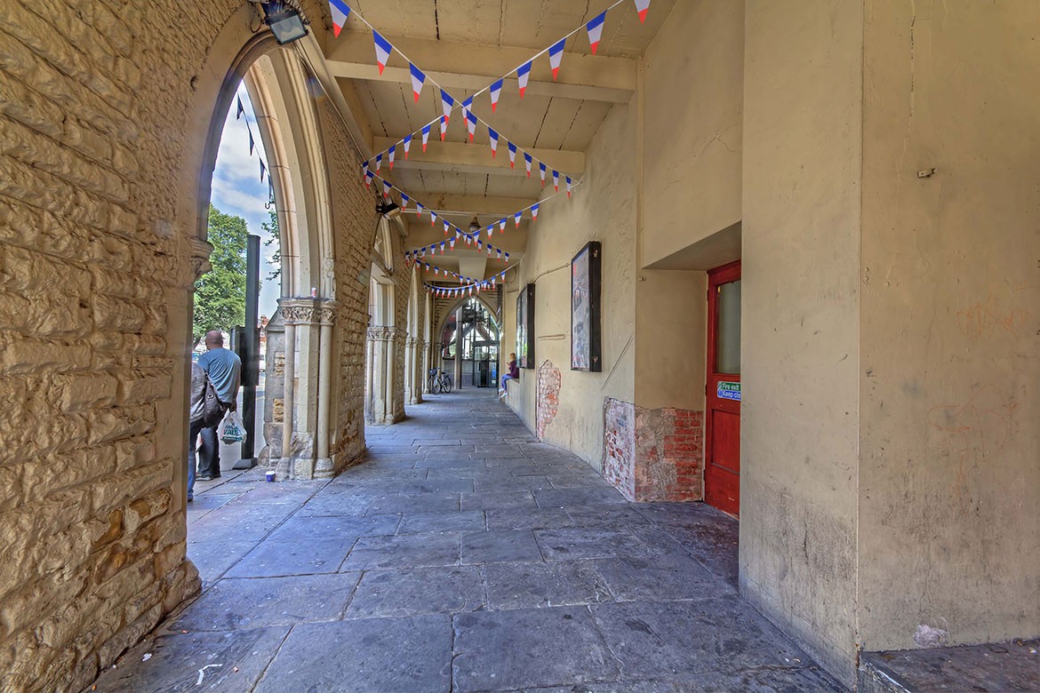 The theatre's colonnade (aka wind tunnel) before the work began. Photograph: Jim Poyner