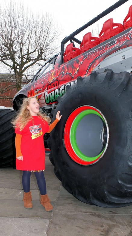 Six-year-old Rhiannon Cossins is amazed by the size of the Monster Truck wheels in York