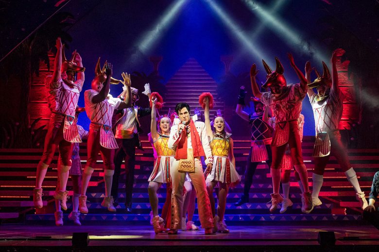 Emilianos Stamatakis in full Elvis mode as the Pharoah as his cheerleaders look on