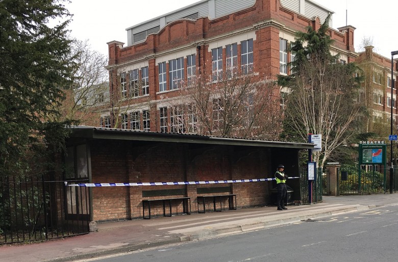 A police officer guards the cordoned off bus shelter outside Joseph Rowntree Theatre on Haxby Road