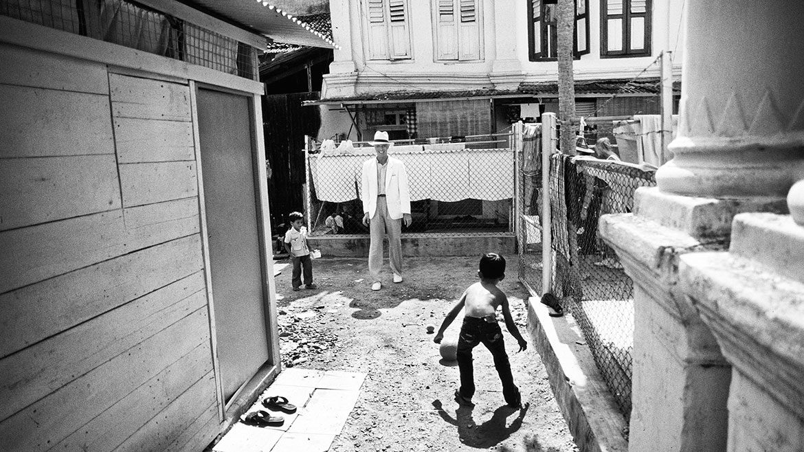 Denis photographed the singer exploring the world in between gigs. This shot is from Singapore in 1983. Photograph © Denis O'Regan