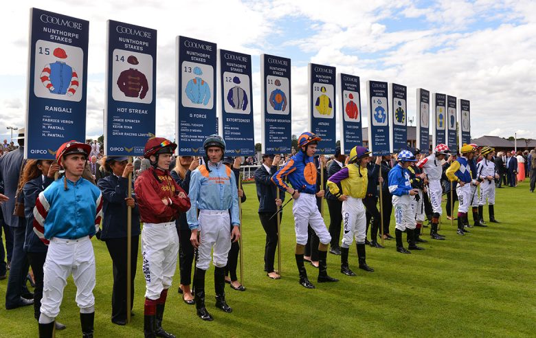 Jockeys line up ahead of the race during the Ebor Festival of 2014. Photograph: York Racecourse