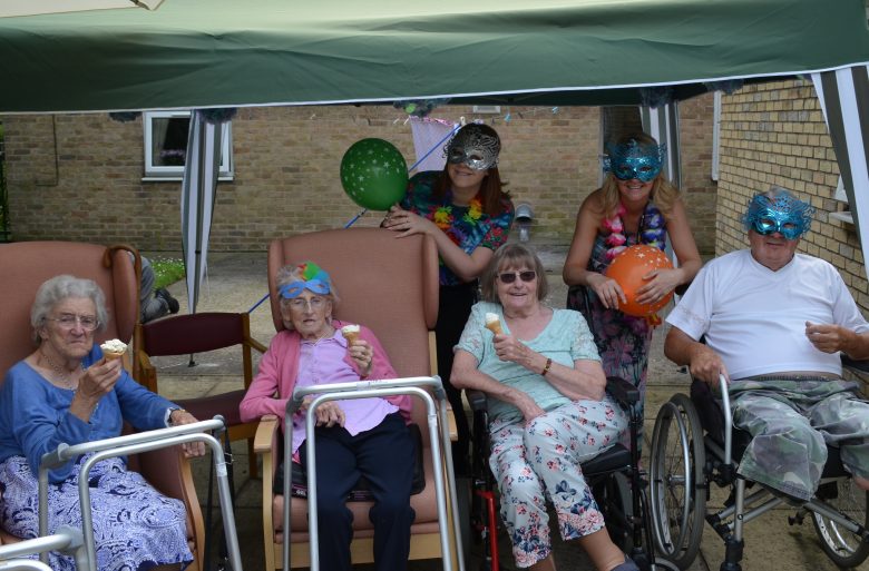 Christina Green and Sophie Johnson, volunteers from Aviva, with residents from Haxby Hall