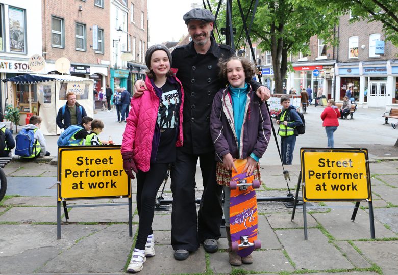 The girls with dad Daryll, who regularly performs in King's Square