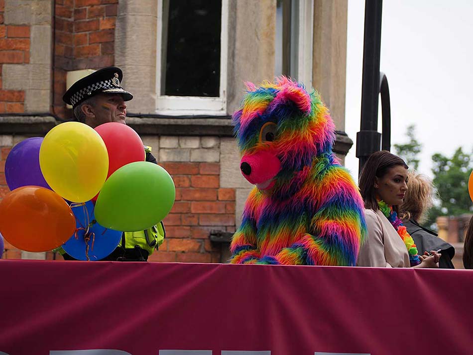 A policeman and a multicoloured bear share a bus through York (that doesn't happen every day…)