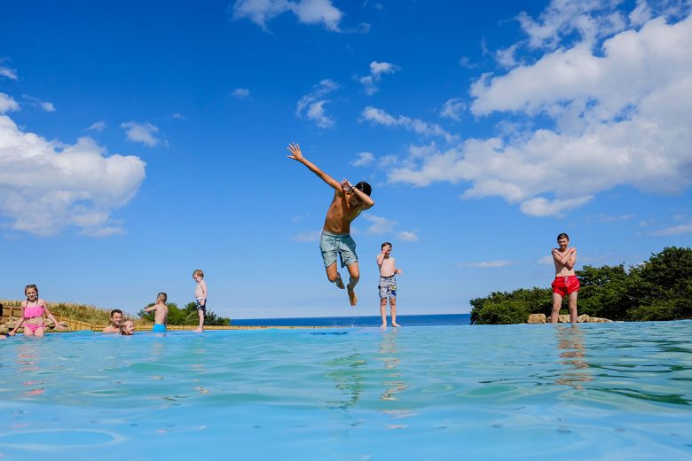 Reuben Ashton enjoys the sunshine as he use the outdoor iodine infinity pool