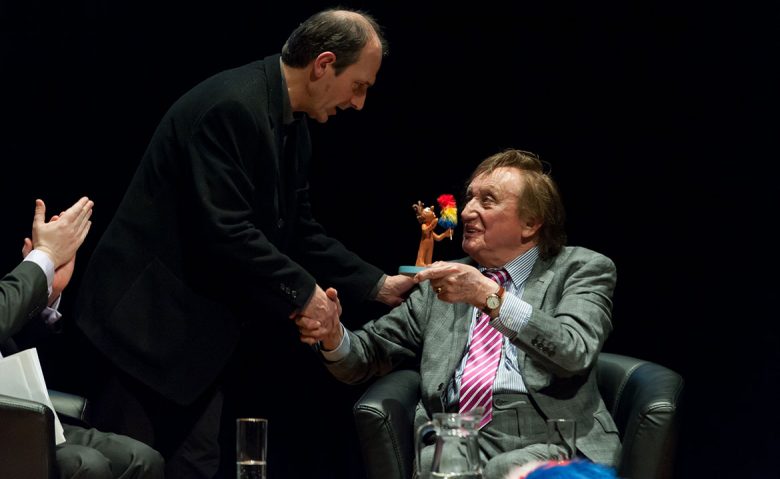 Receiving his award from  Armando Iannucci