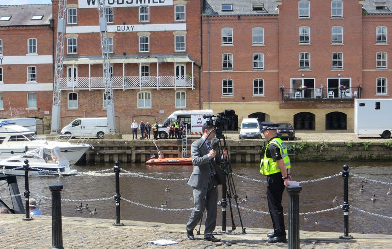 Police were giving media interviews by the river