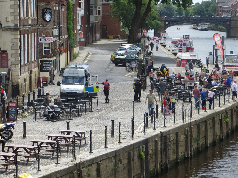Another view of the police presence by the river