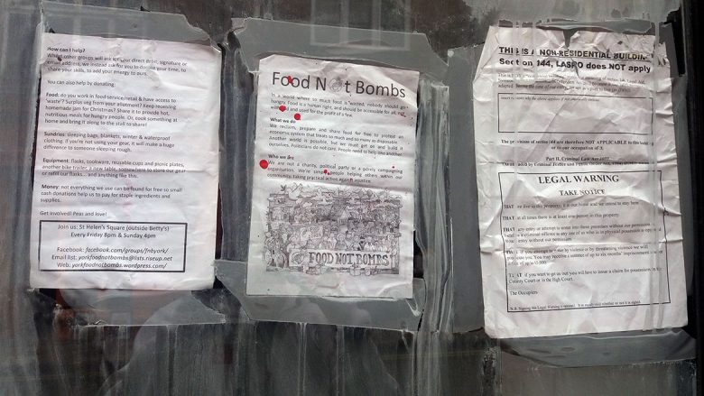 The notices pasted to the window of the shop