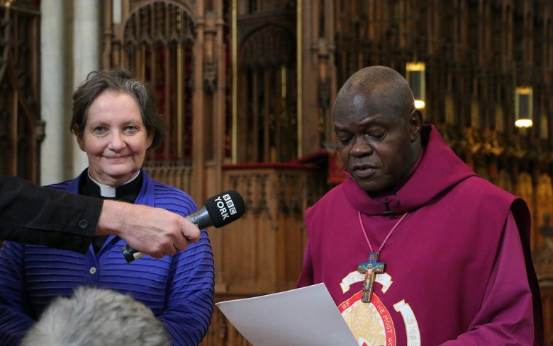 Dean Faull listens as Dr Sentamu reads out the statement