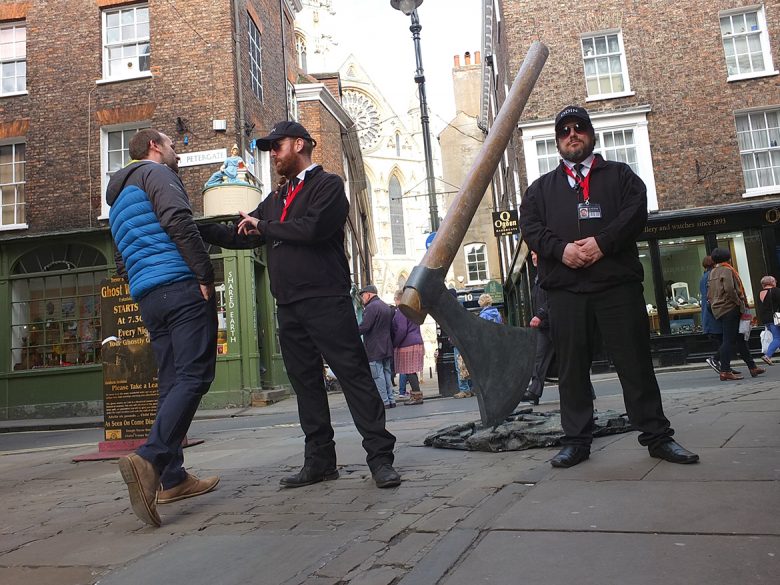Agents of ODIN prevent the public from getting too close to the giant axe