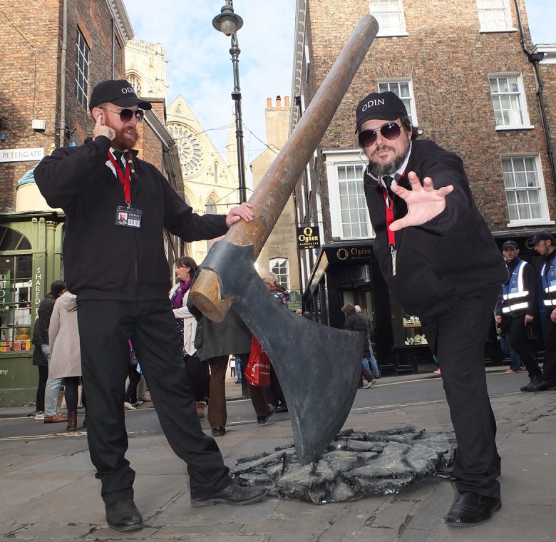 Agents of Odin investigate the giant axe buried in a York street. Photograph: Pyper York