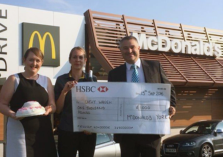 John presents a cheque for £1,000 to Cathy Waugh after she clocked up 30 years' service