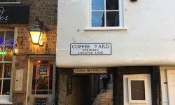 Water pours through ceiling of building in historic York courtyard